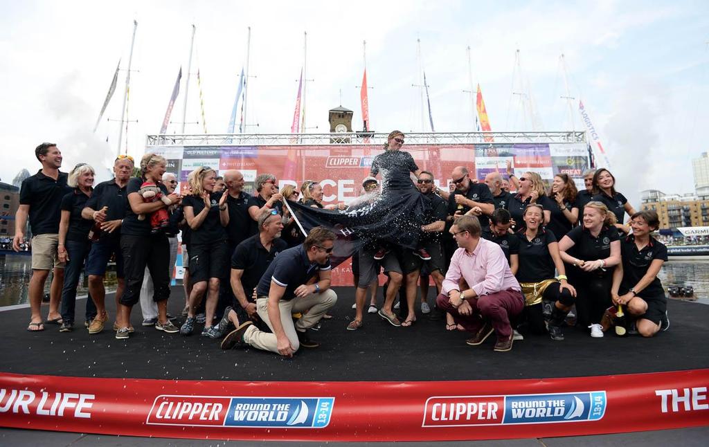 Members of the Henri Lloyd team celebrate winning the overall race on the podium after the Round the World Race Finish in London. © Clipper Ventures